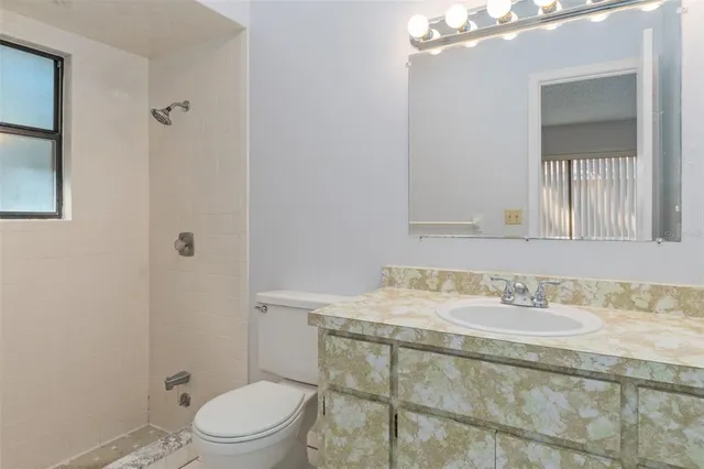 a view of an empty room with closet area