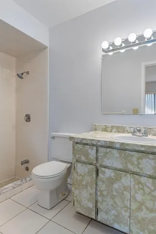 a view of an empty room and a window