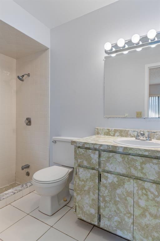 72 Chinaberry Circle Homosassa, FL 34446 - Photo 22 of 56 a bathroom with a granite countertop sink a toilet and a mirror