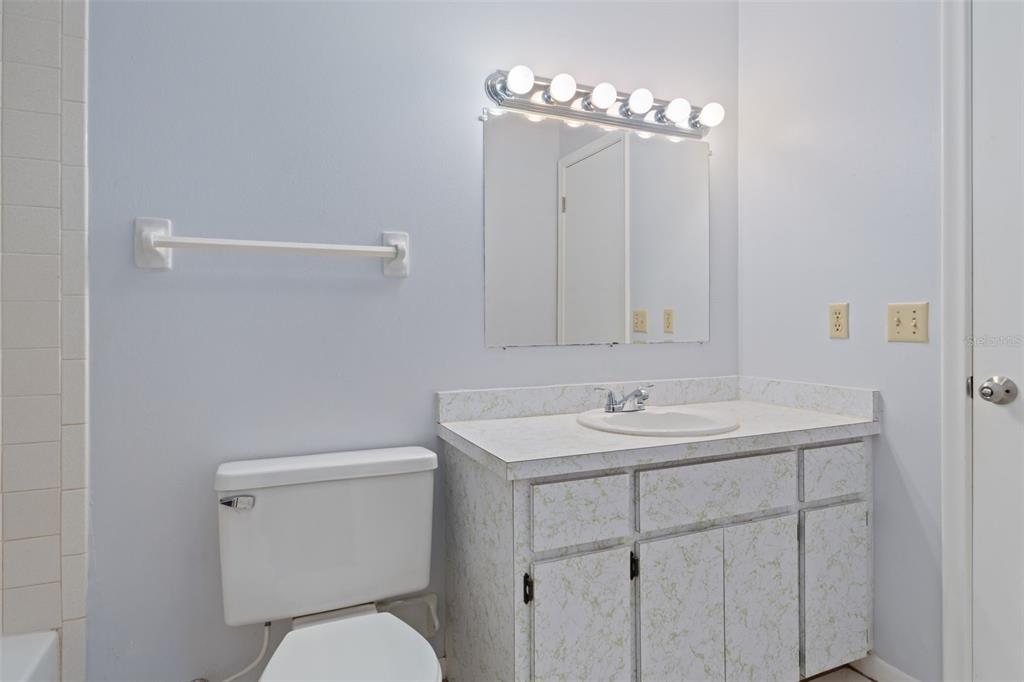 72 Chinaberry Circle Homosassa, FL 34446 - Photo 26 of 56 a bathroom with a toilet sink and mirror