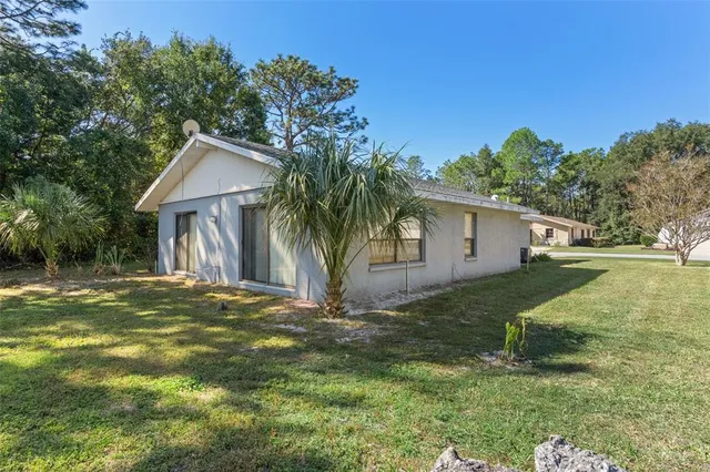 a view of a patio with swimming pool and table