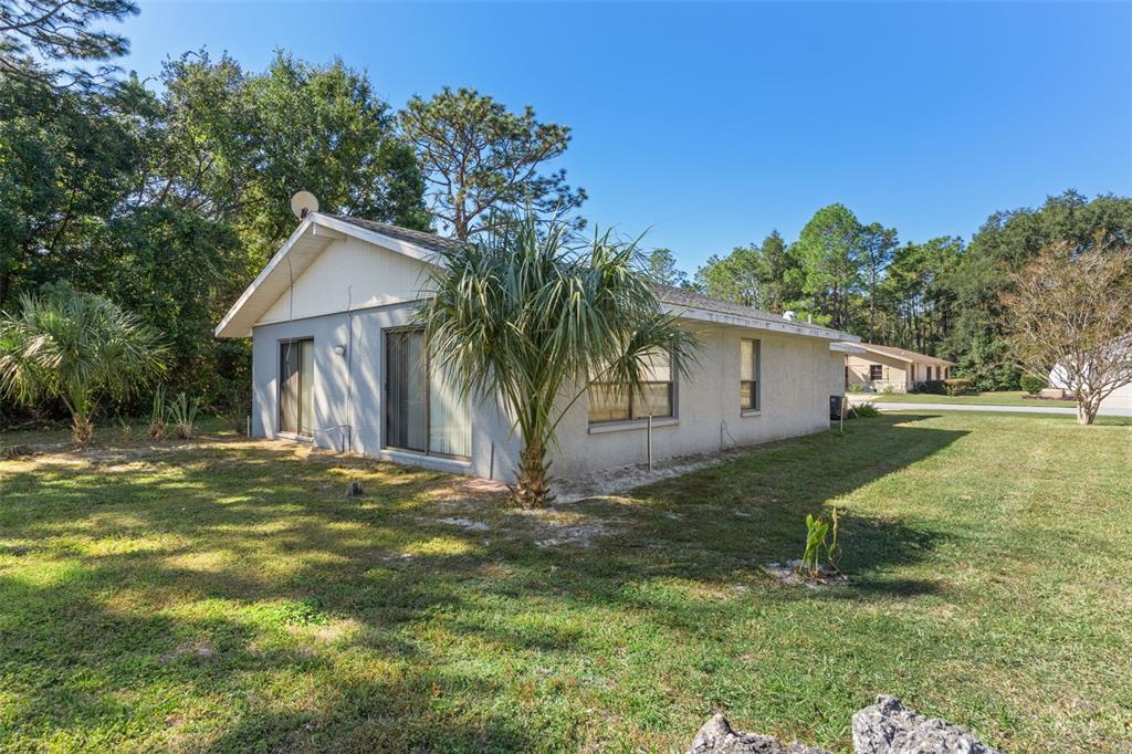 72 Chinaberry Circle Homosassa, FL 34446 - Photo 33 of 56 a view of a house with a yard
