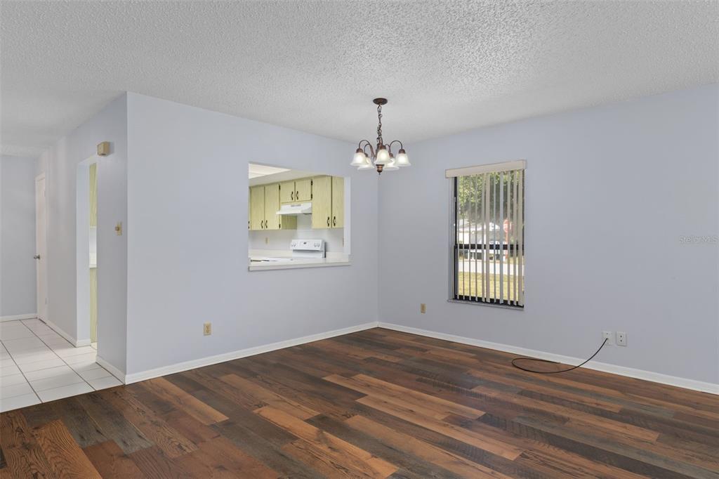 72 Chinaberry Circle Homosassa, FL 34446 - Photo 8 of 56 a view of an empty room with wooden floor and a window