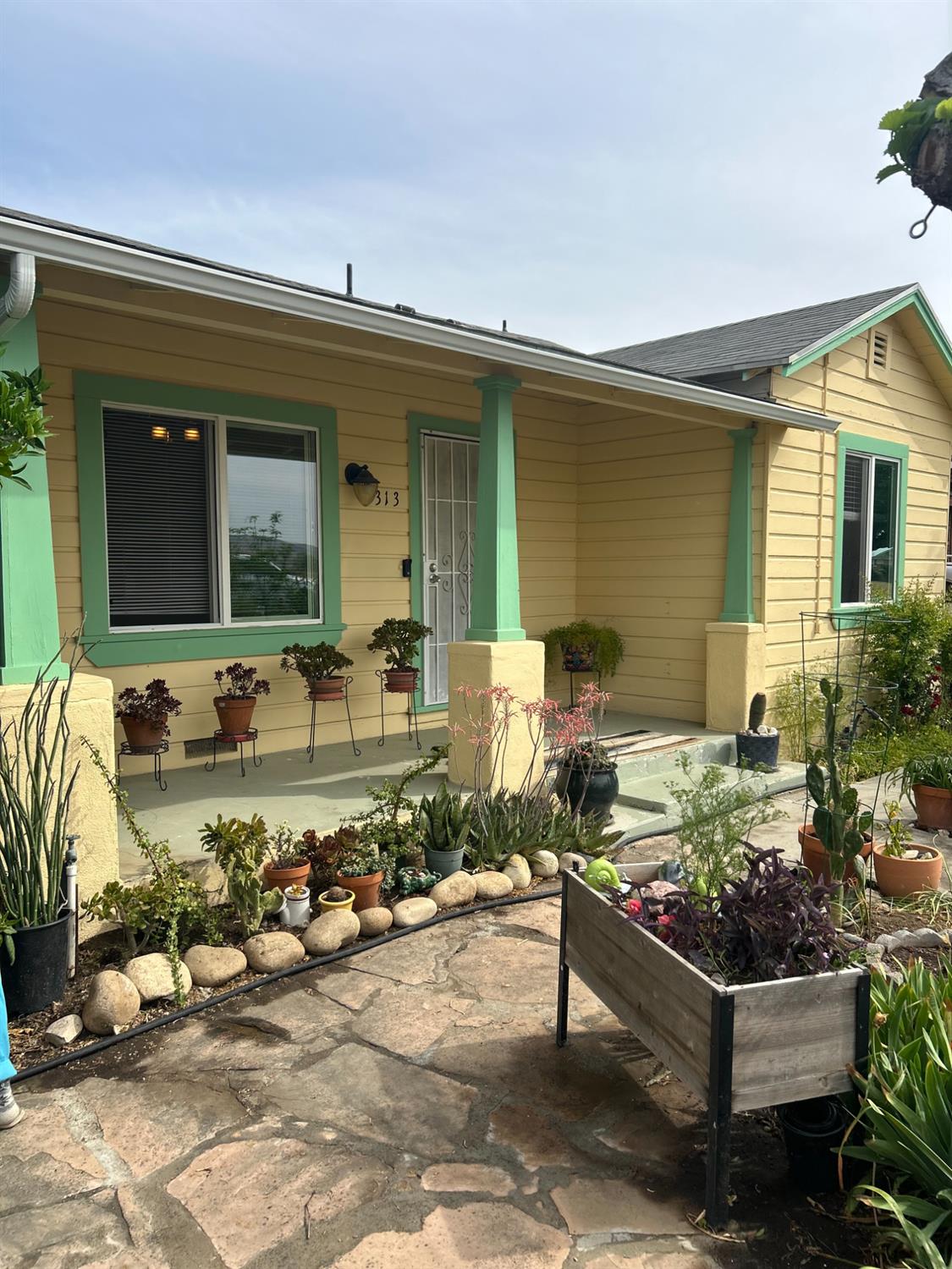 313 East Sacramento Street Coalinga, CA 93210 - Photo 2 of 23 a front view of a house with outdoor seating