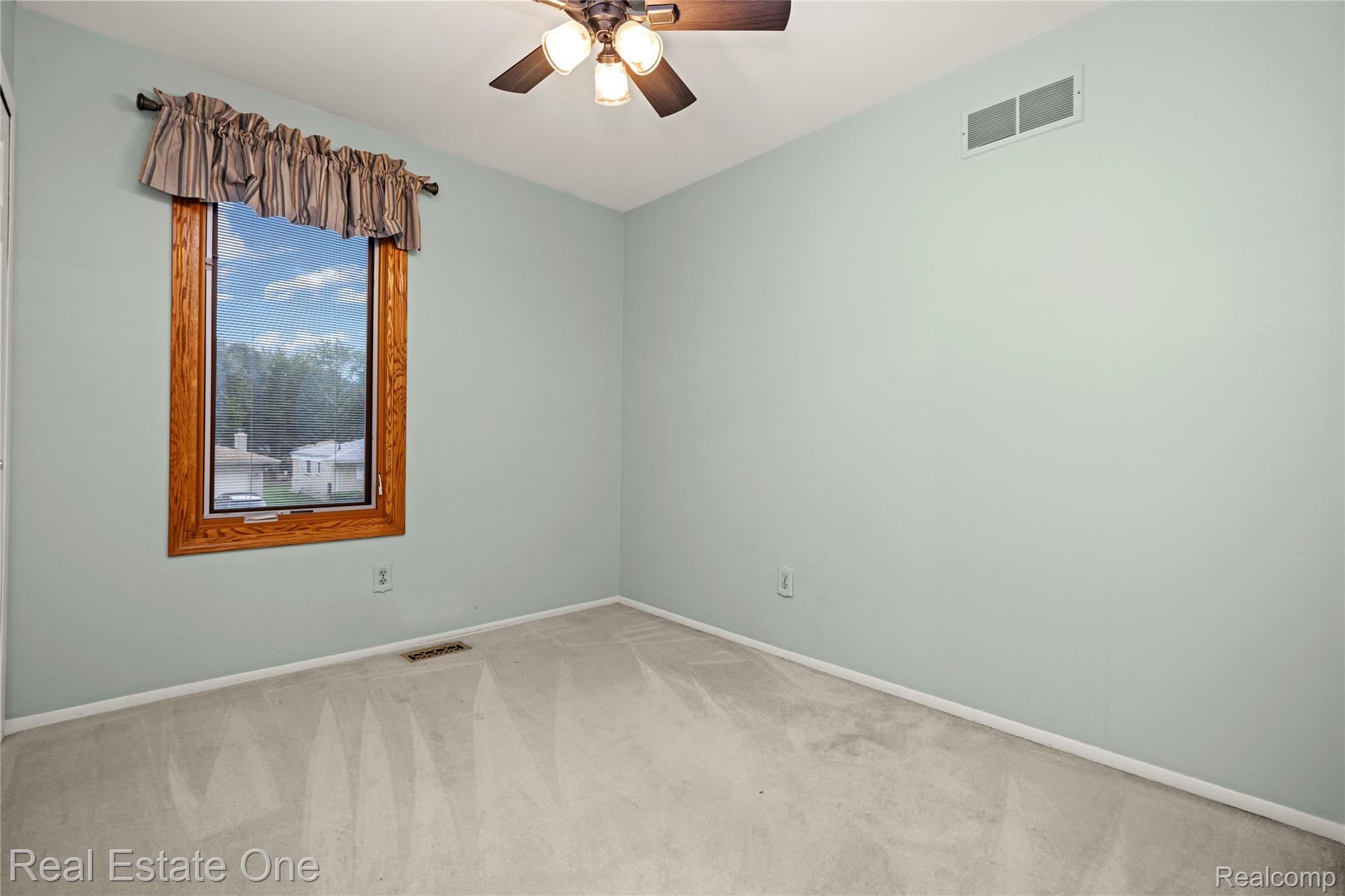 39750 Cheviot Road Canton, MI 48188 - Photo 43 of 71 Light blue painted walls with light gray carpeting
