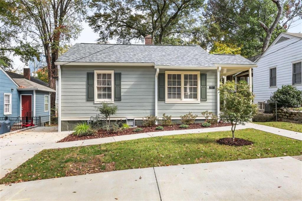 1257 Lyle Place Northwest Atlanta, GA 30318 - Photo 1 of 1 front view of a house with a yard