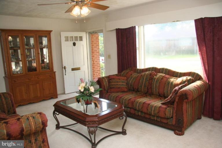 1702 Donald Place Silver Spring, MD 20902 - Photo 3 of 22 a living room with furniture and a window