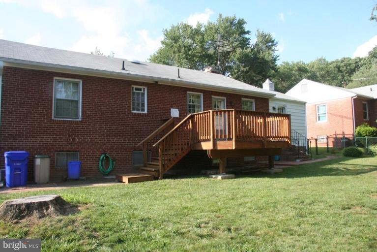 1702 Donald Place Silver Spring, MD 20902 - Photo 22 of 22 a front view of a house with a garden