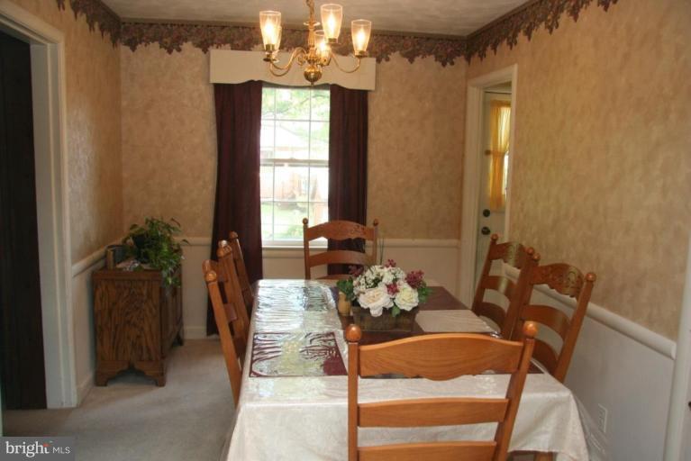 1702 Donald Place Silver Spring, MD 20902 - Photo 5 of 22 a dining room with furniture and window