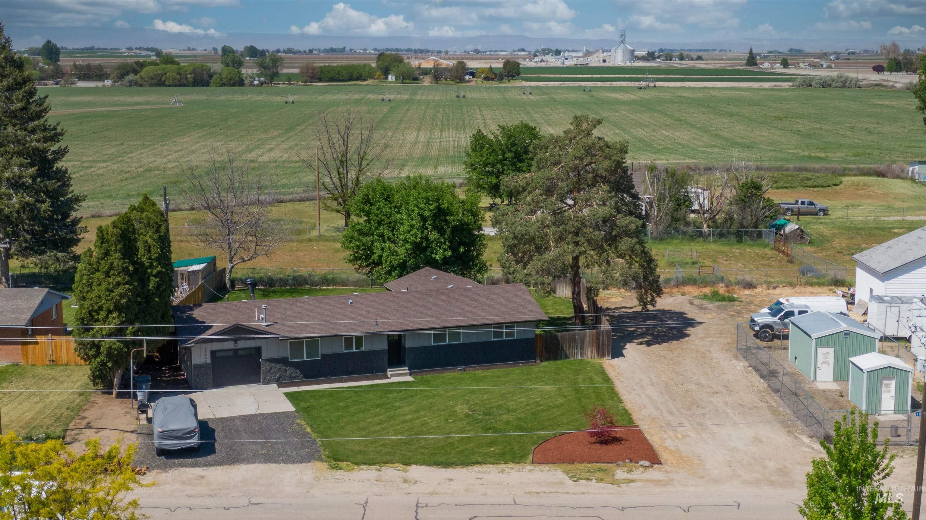 20803 Friends Road Greenleaf, ID 83626 - Photo 32 of 39 Single-story property with a dark-toned exterior and a contrasting light roof