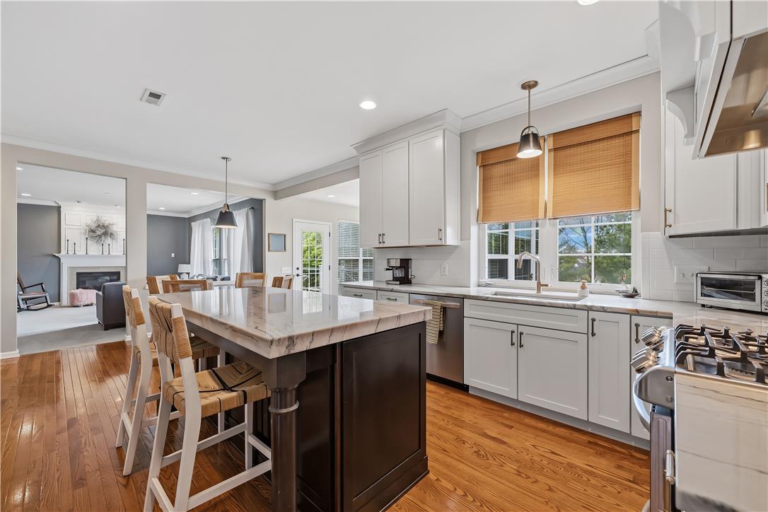 9031 Pathfinder Road Breinigsville, PA 18031 - Photo 12 of 63 Culinary aspirations find their home in this well-appointed kitchen, flowing into an inviting living space.