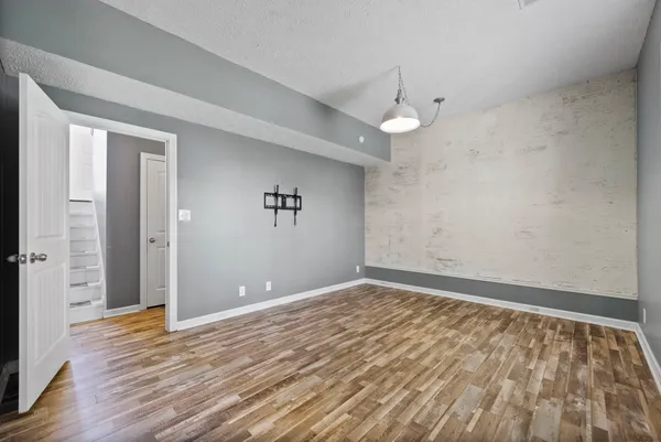a view of a livingroom with wooden floor