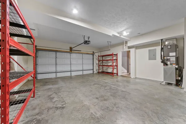 en empty room with ceiling fan and window