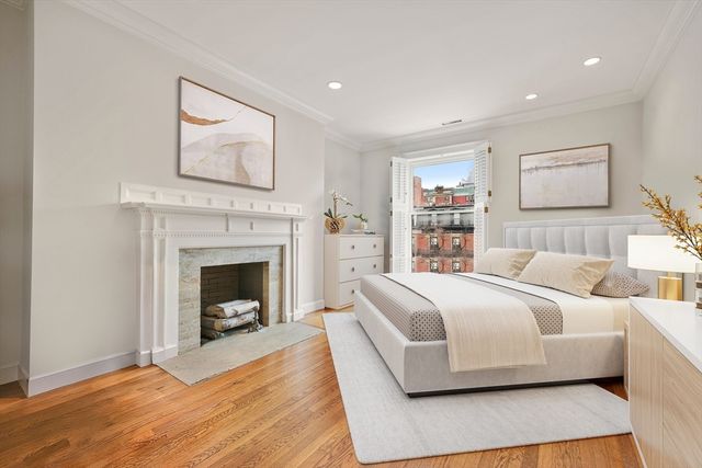 a bed room with a bed and a fireplace