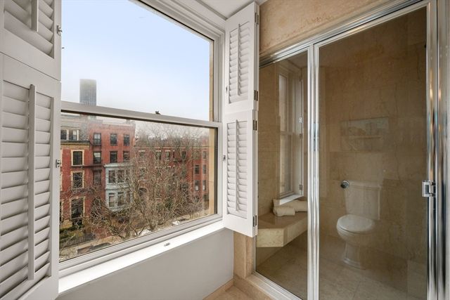 a bathroom with a glass shower door