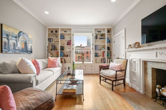 a living room with furniture fireplace and flat screen tv