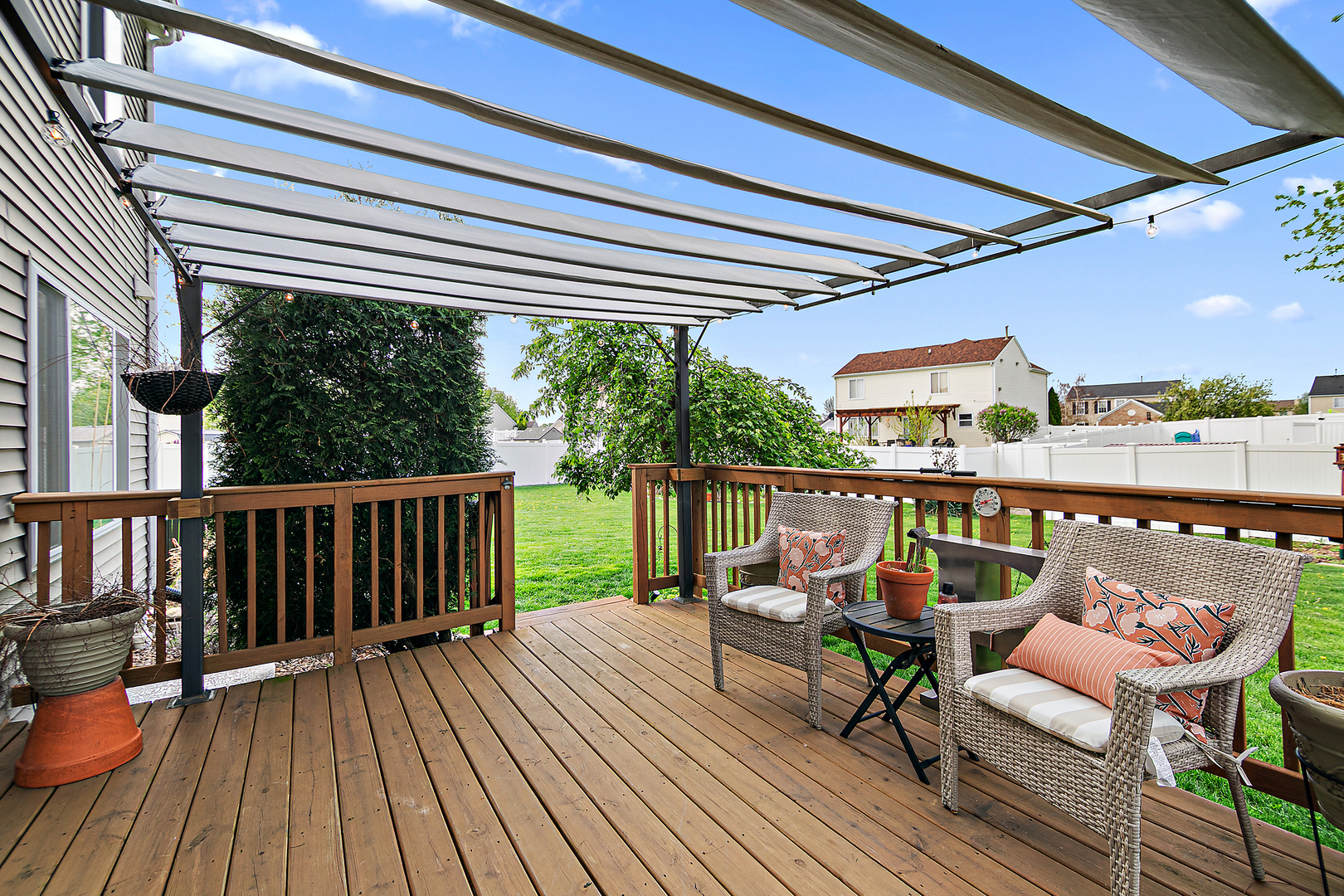 2256 Swallowtail Street Bourbonnais, IL 60914 - Photo 11 of 29 a balcony with wooden floor outdoor seating and city view