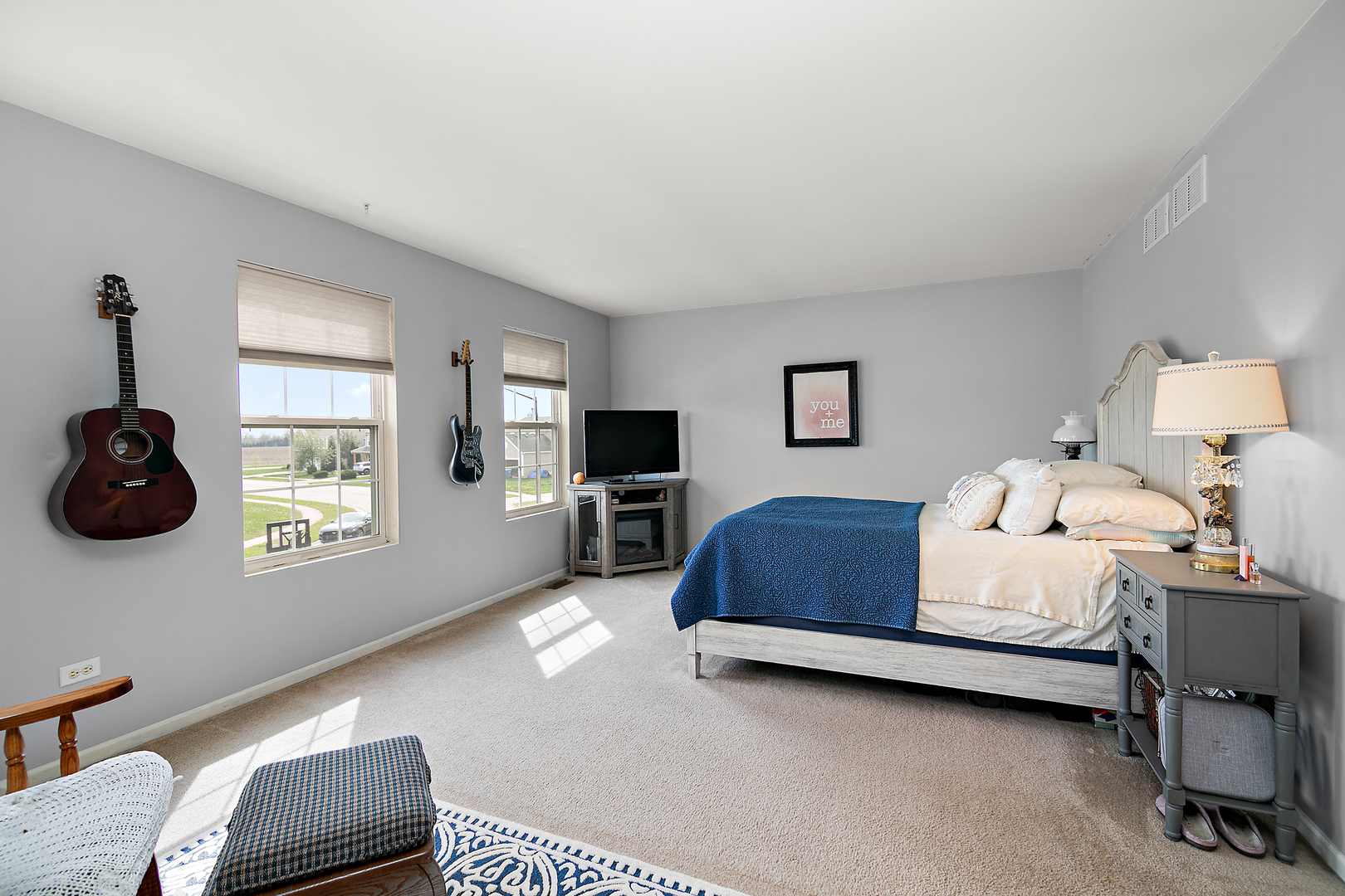 2256 Swallowtail Street Bourbonnais, IL 60914 - Photo 15 of 29 a bedroom with a bed chair and window