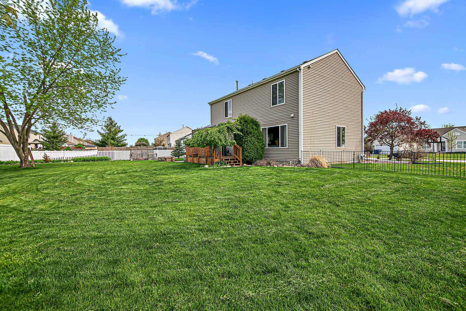 2256 Swallowtail Street Bourbonnais, IL 60914 - Photo 26 of 29 a view of a house with a yard and garage