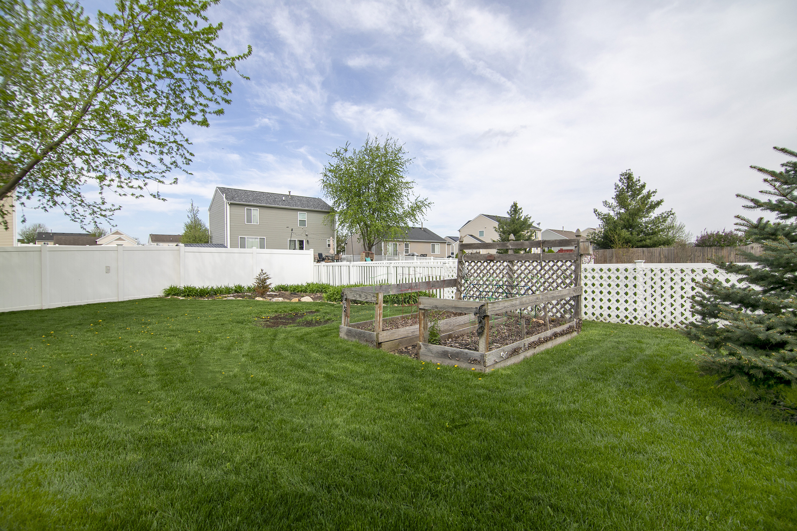 2256 Swallowtail Street Bourbonnais, IL 60914 - Photo 28 of 29 a view of a house with a yard and sitting area