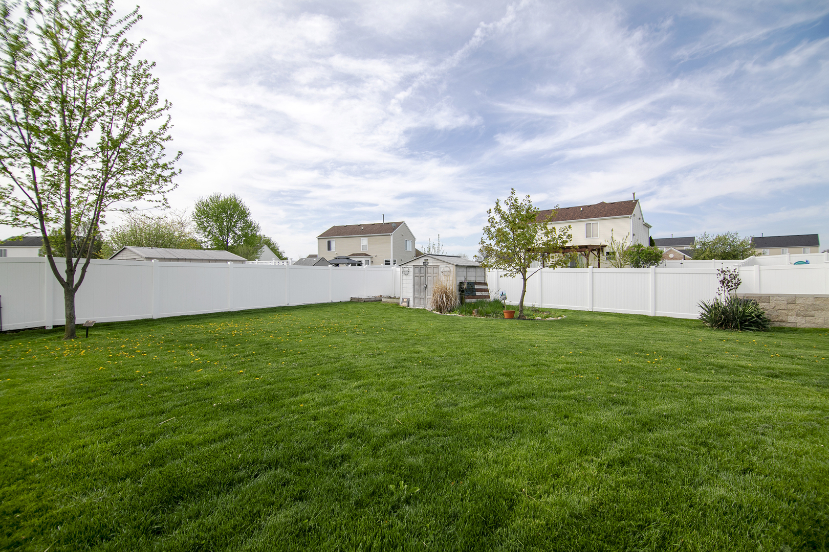 2256 Swallowtail Street Bourbonnais, IL 60914 - Photo 29 of 29 a view of a backyard with sitting area