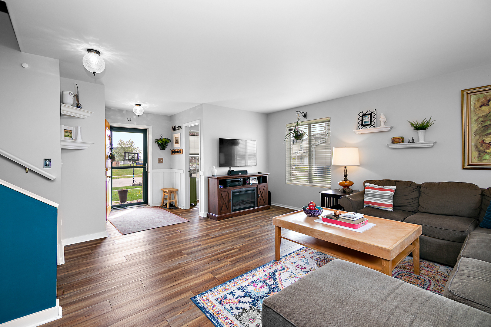 2256 Swallowtail Street Bourbonnais, IL 60914 - Photo 3 of 29 a living room with furniture fireplace and wooden floor