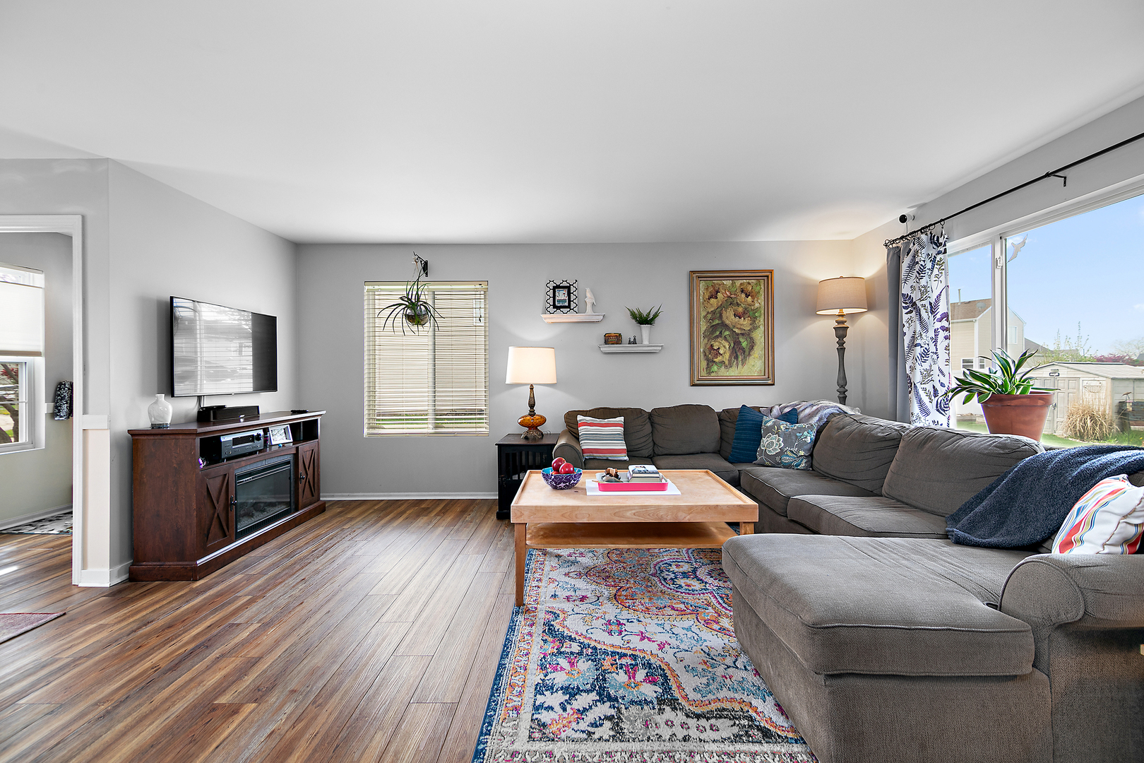 2256 Swallowtail Street Bourbonnais, IL 60914 - Photo 5 of 29 a living room with furniture and a flat screen tv
