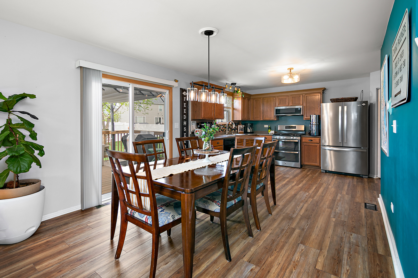 2256 Swallowtail Street Bourbonnais, IL 60914 - Photo 7 of 29 a view of a dining room with furniture window and wooden floor