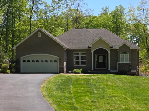 an aerial view of a house with outdoor space