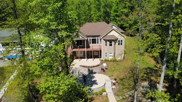 a aerial view of a house with swimming pool and porch