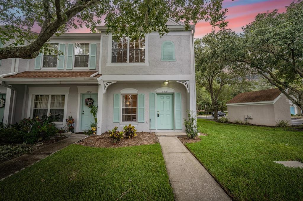 8560 Hunters Key Circle Tampa, FL 33647 - Photo 1 of 1 a front view of a house with a garden