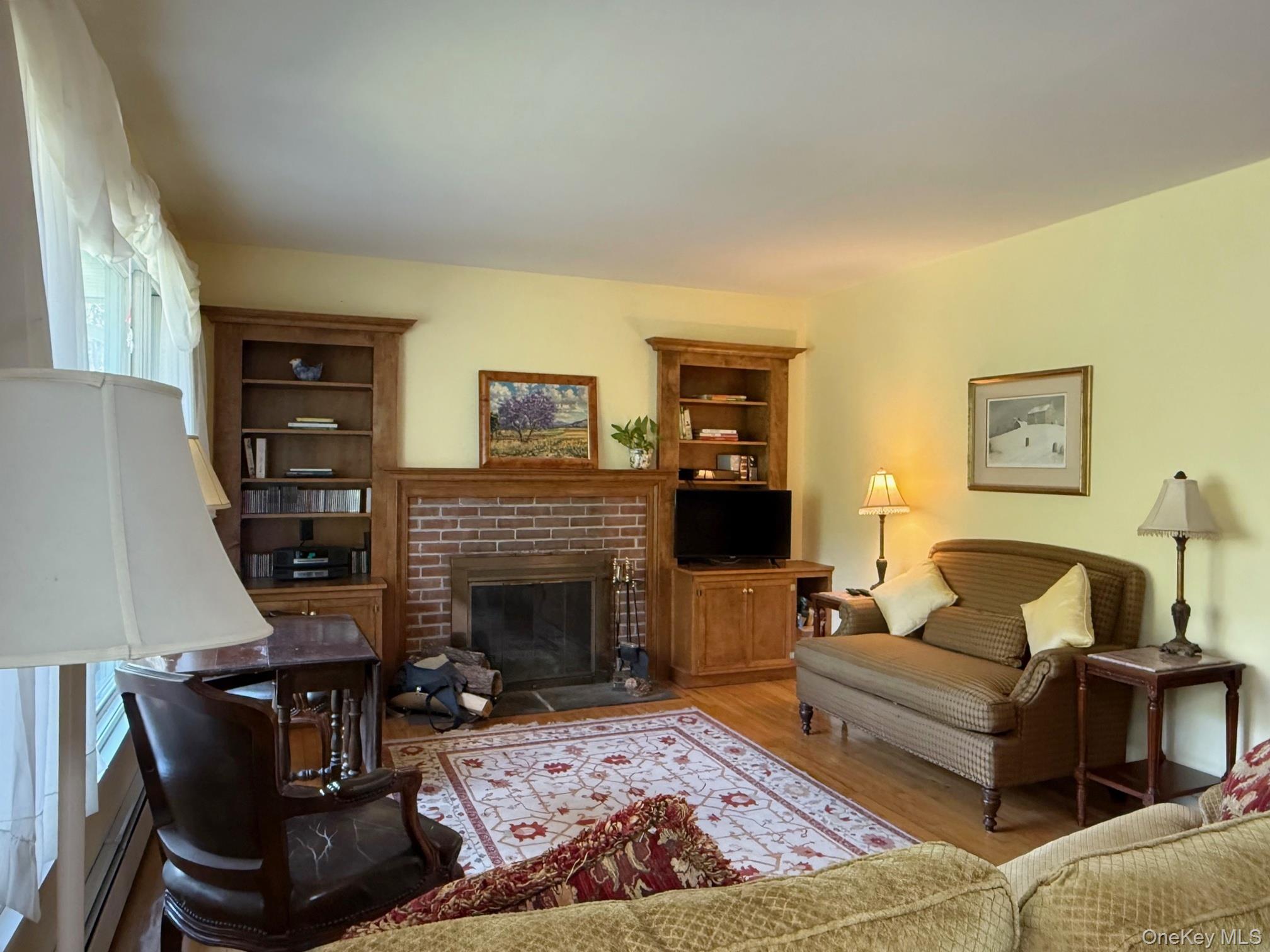 230 Cooper Road Millerton, NY 12546 - Photo 10 of 20 a living room with furniture and a fireplace
