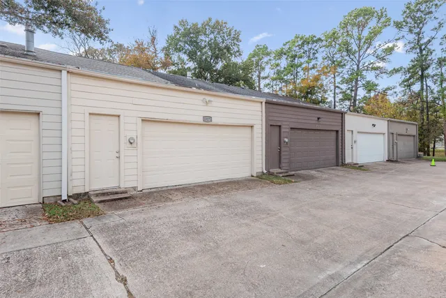 a view of garage and yard