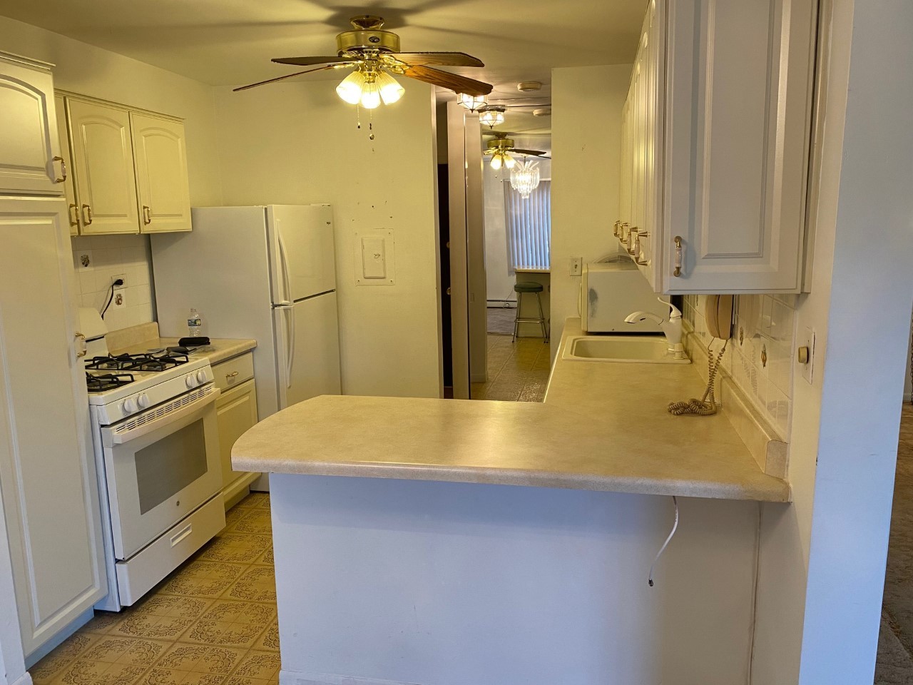 906 East Old Willow Road, Unit 104 Prospect Heights, IL 60070 - Photo 7 of 20 a kitchen with a sink appliances and cabinets