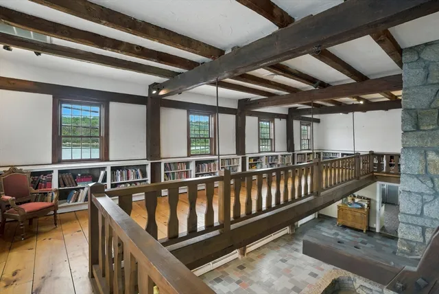 a balcony with table and chairs