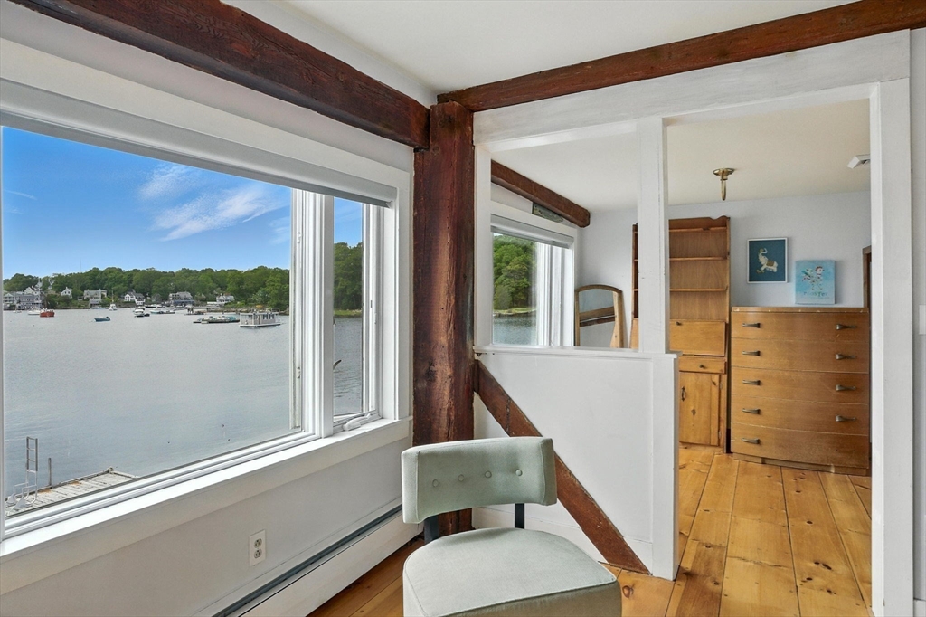 672 Washington Street Gloucester, MA 01930 - Photo 18 of 27 a balcony with table and chairs