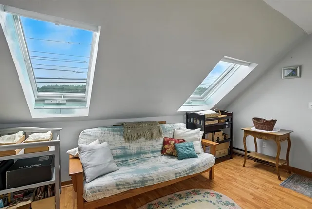 a bench sitting in the middle of a lake next to a building