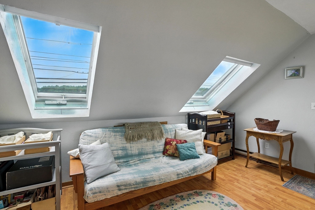 672 Washington Street Gloucester, MA 01930 - Photo 23 of 27 a living room with furniture and a fireplace