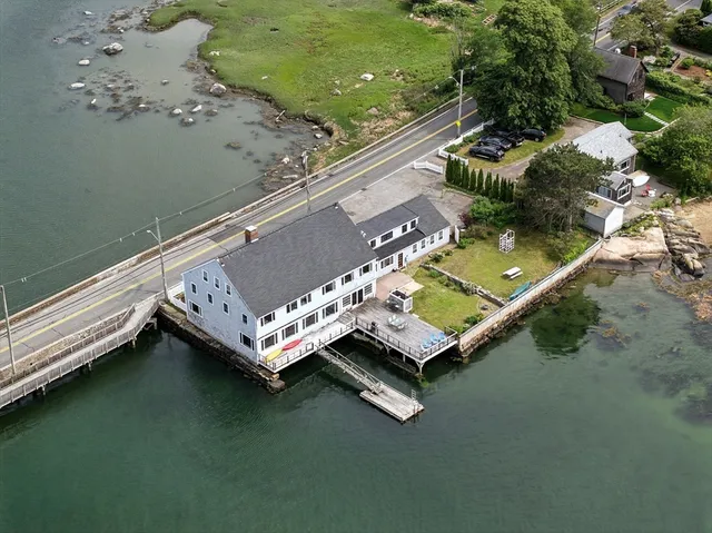 an aerial view of a livingroom with table & chairs