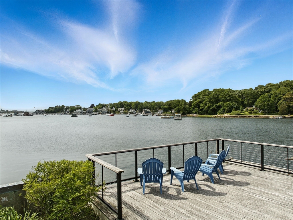 672 Washington Street Gloucester, MA 01930 - Photo 5 of 27 a view of a lake with tables and chairs