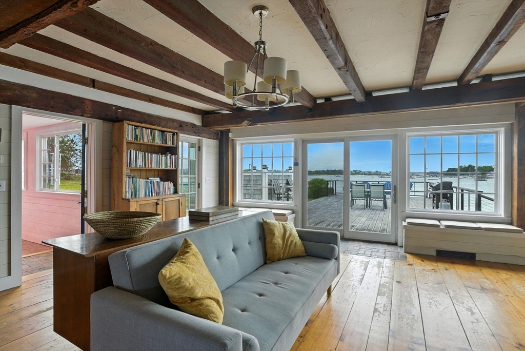 672 Washington Street Gloucester, MA 01930 - Photo 10 of 27 a living room with furniture and large windows