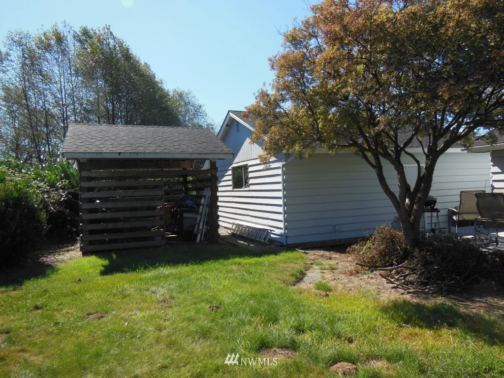 28408 Fern Bluff Road Monroe, WA 98272 - Photo 4 of 22 a view of a house with a yard plants and large tree