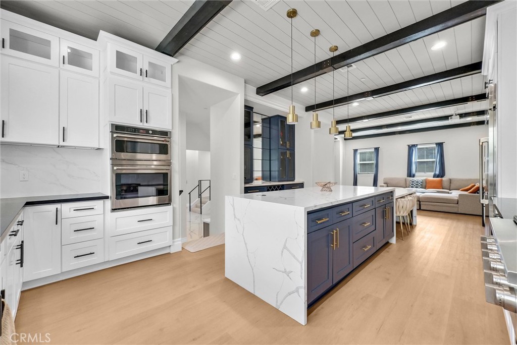 451 Avenida Esplendor Walnut, CA 91789 - Photo 13 of 51 a large white kitchen with cabinets