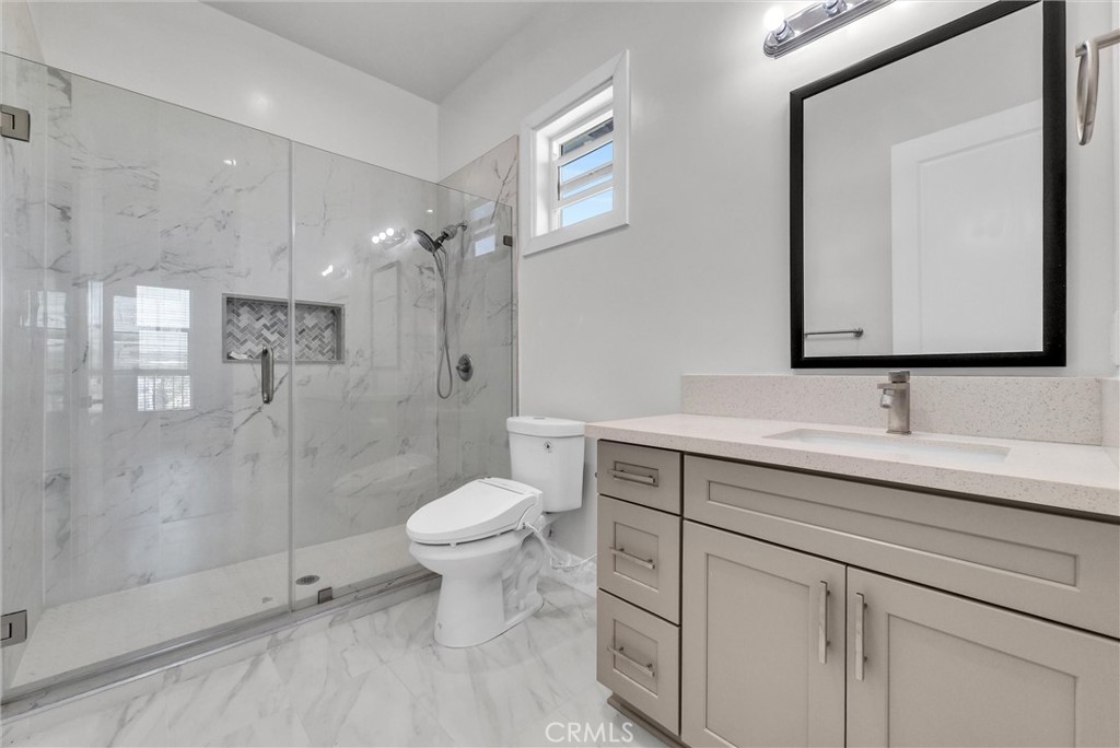 451 Avenida Esplendor Walnut, CA 91789 - Photo 24 of 51 a bathroom with a toilet sink a shower and