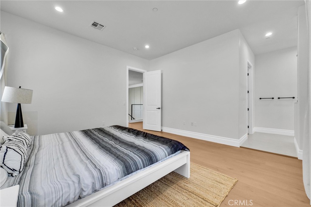 451 Avenida Esplendor Walnut, CA 91789 - Photo 27 of 51 a bedroom with a bed and painting on the wall