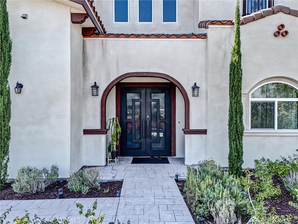 451 Avenida Esplendor Walnut, CA 91789 - Photo 4 of 51 a front view of a house with a garden
