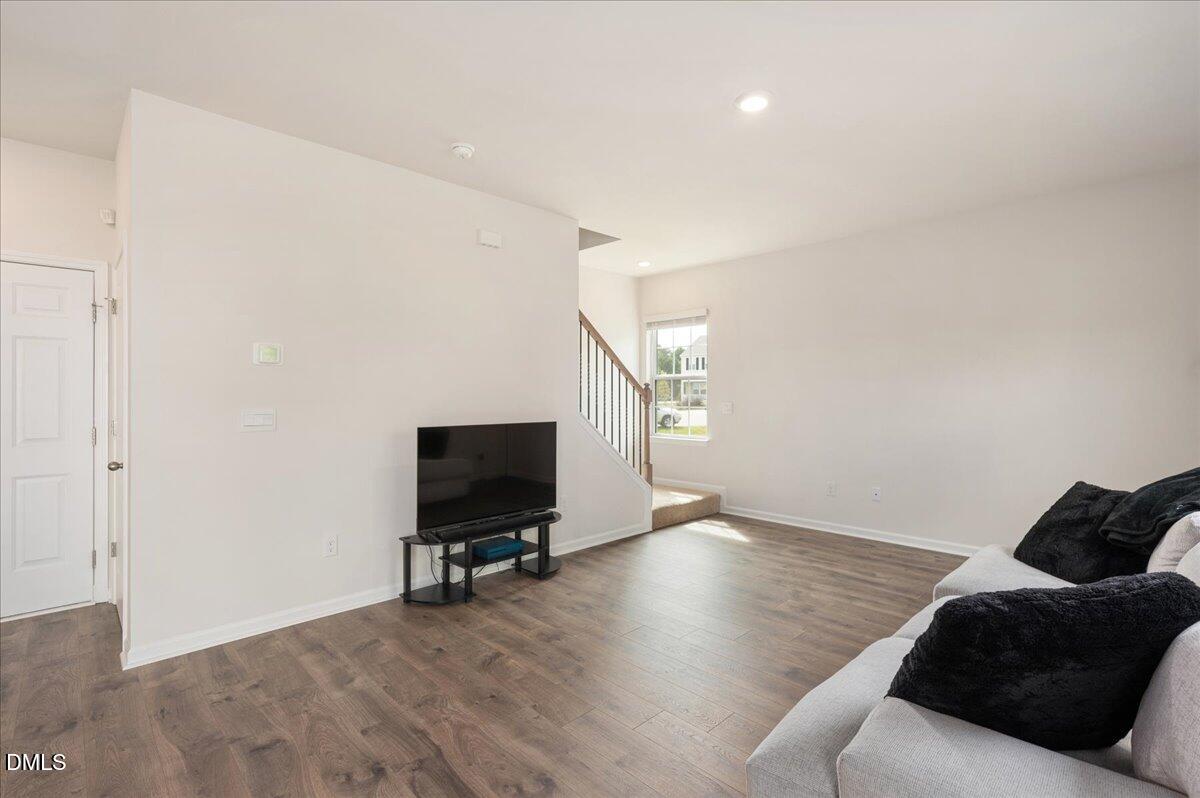 10 Whispering Willow Circle Youngsville, NC 27596 - Photo 11 of 28 a living room with furniture and a flat screen tv