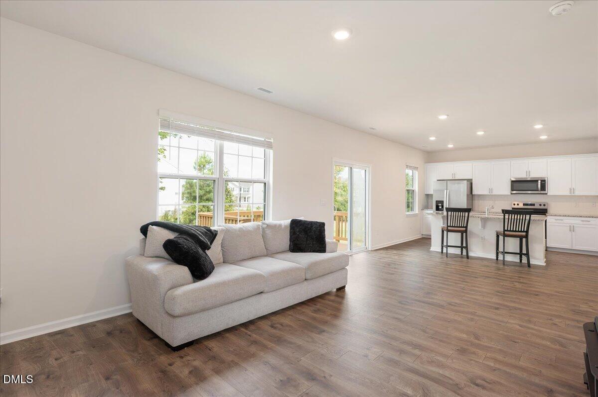 10 Whispering Willow Circle Youngsville, NC 27596 - Photo 13 of 28 a living room with furniture and a large window