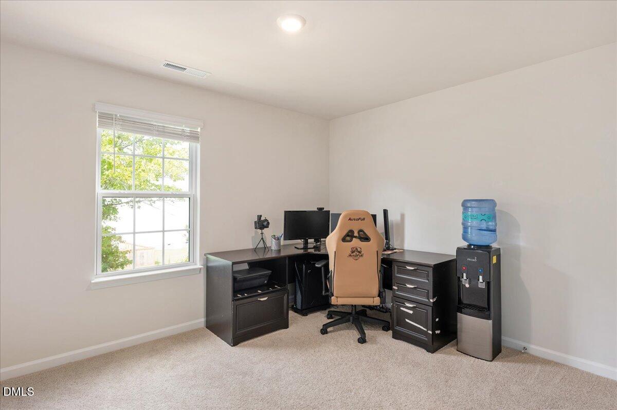 10 Whispering Willow Circle Youngsville, NC 27596 - Photo 15 of 28 a view of a workspace with furniture and a window