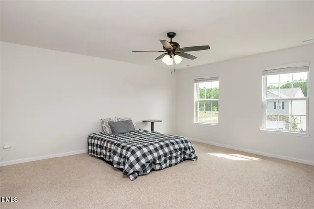 a bedroom with a bed furniture and a window